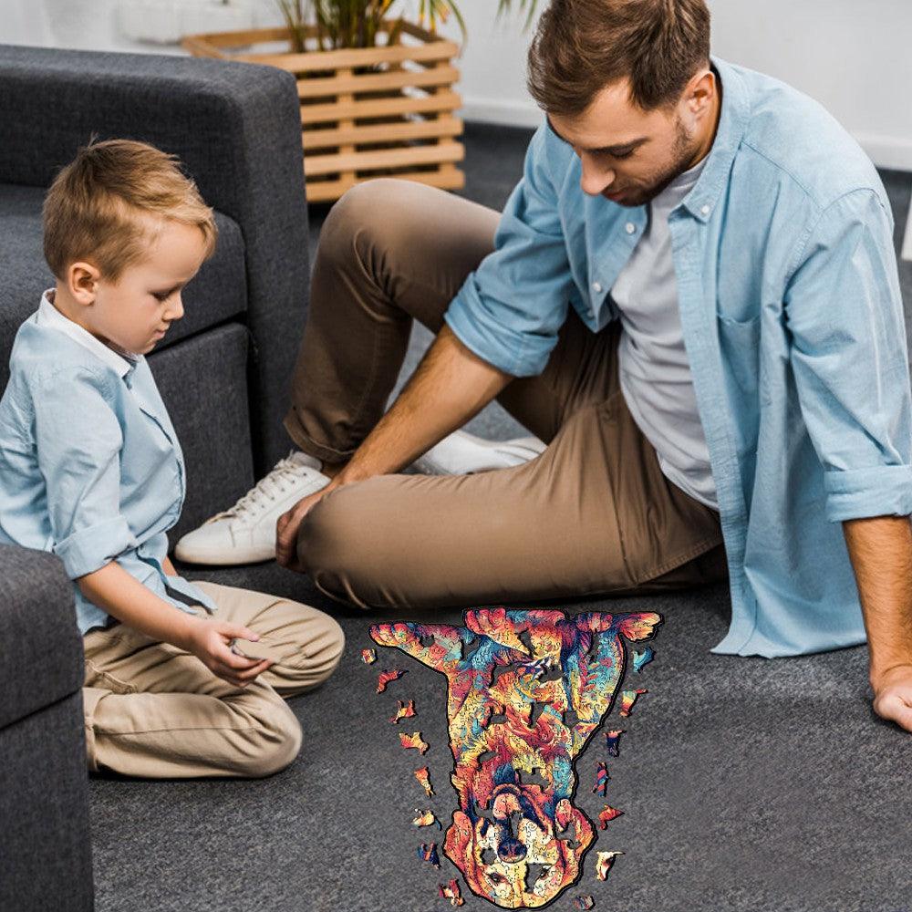 Father and son enjoying a vibrant Loyal Golden Retriever wooden jigsaw puzzle together on the floor.