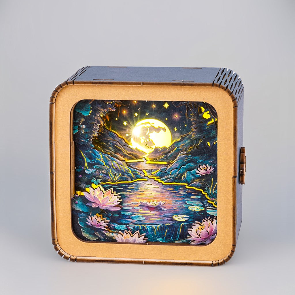3D wooden puzzle night light featuring a serene moonlit pond scene with blooming lotus flowers.