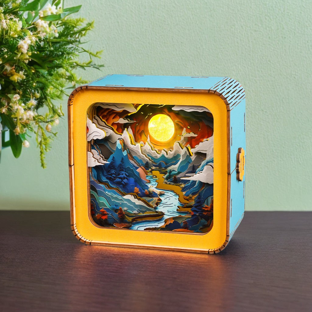 Moonlit Mountain 3D wooden puzzle night light showcasing a serene landscape with mountains and a glowing sun.