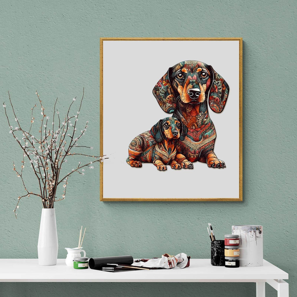 Colorful art print of two dachshunds in intricate designs, displayed on a stylish tabletop with decor.