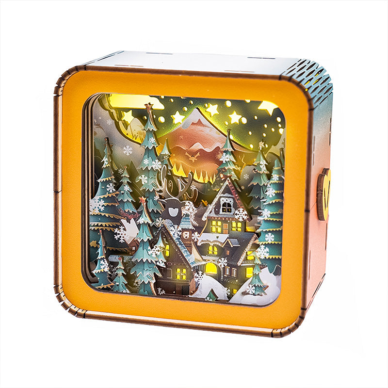 Warm Christmas Eve Kit featuring a 3D wooden puzzle night light with a cozy winter scene and illuminated houses.