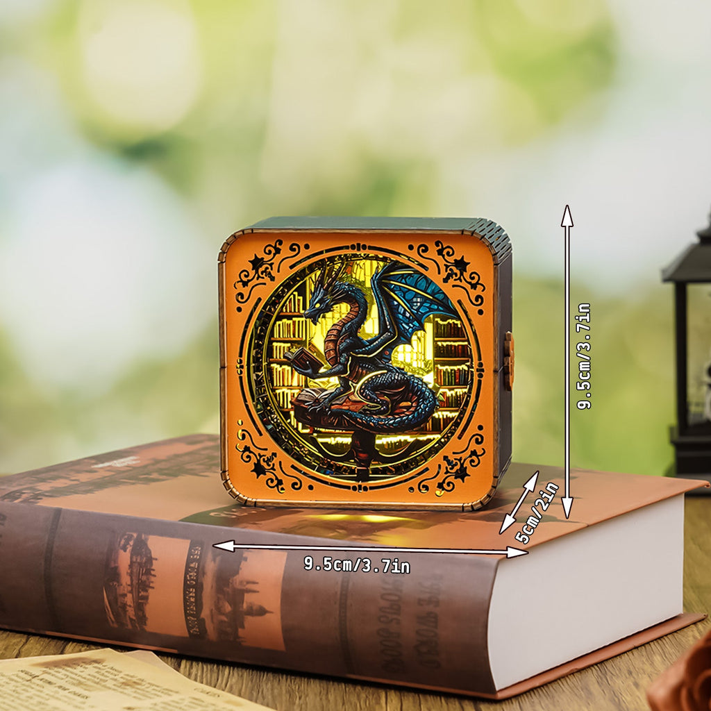 Library Dragon Kit 3D wooden puzzle night light showcased on a book, featuring dragon design and measurement indicators.