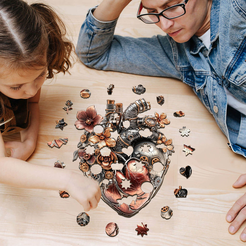 Child and adult assembling 3D Mechanical Heart Wooden Jigsaw Puzzle on a wooden table.