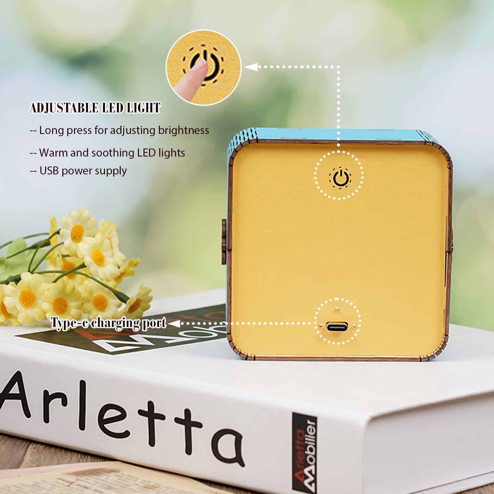 Close-up of adjustable LED light on a wooden puzzle night light with USB charging port.