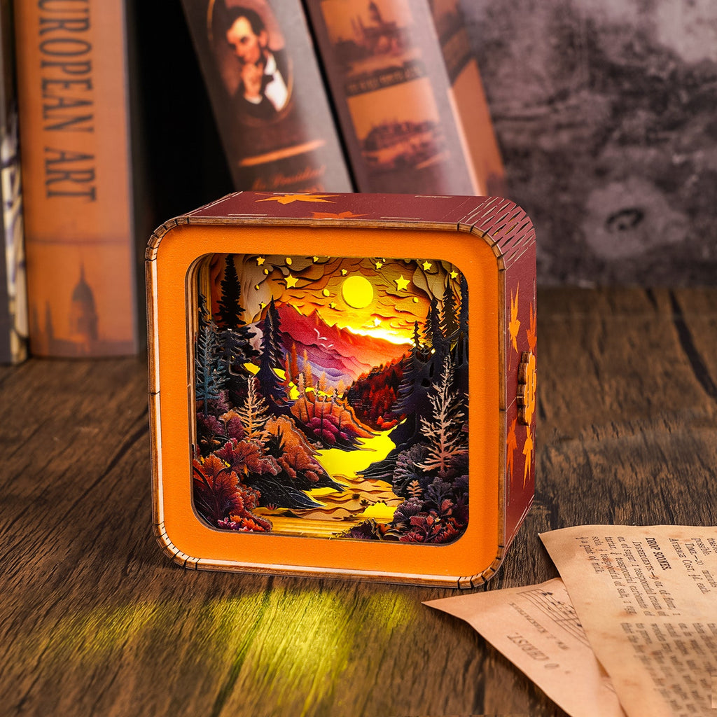3D wooden puzzle night light featuring a vibrant forest sunset scene with mountains and a flowing river.