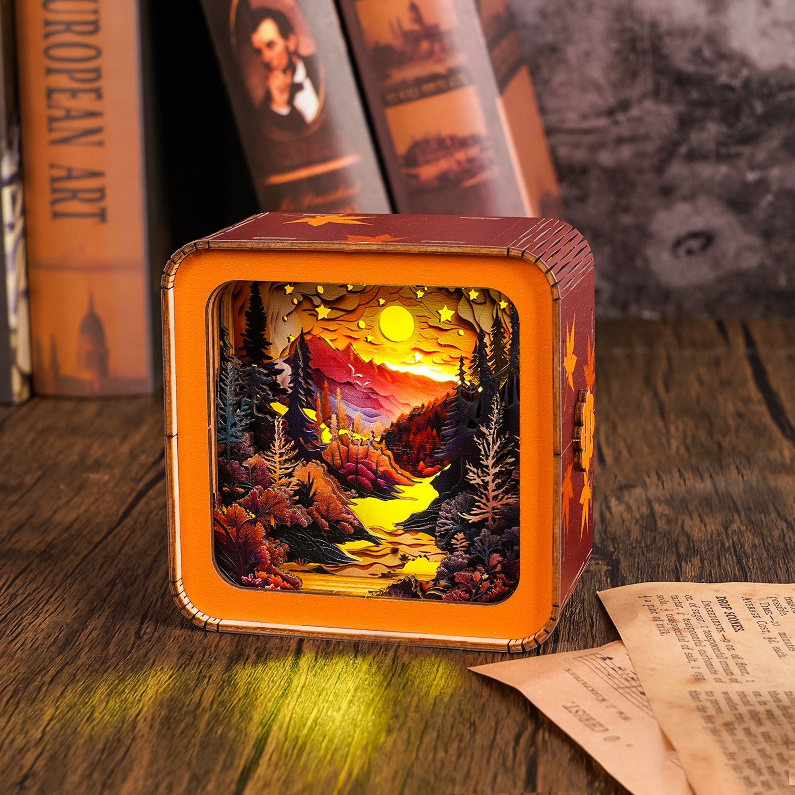 3D wooden puzzle night light featuring a vibrant forest sunset scene with mountains and a flowing river.
