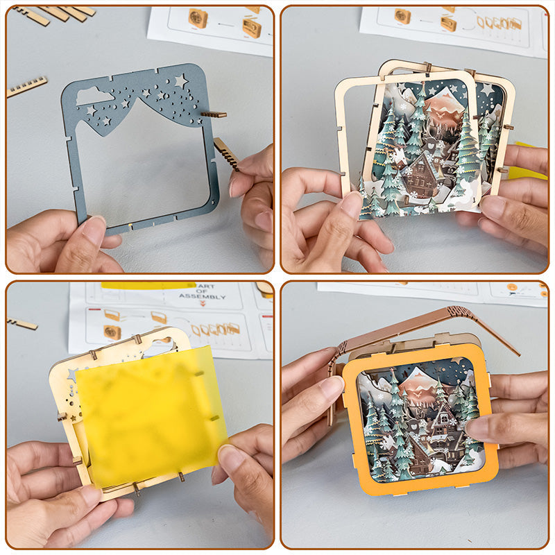 Hands assembling a 3D wooden puzzle night light depicting a snowy landscape and cabin scene.