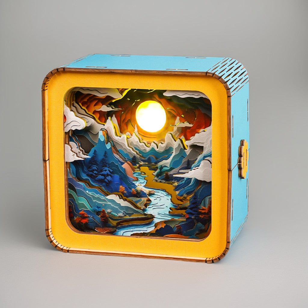 Moonlit Mountain 3D wooden puzzle night light showcasing intricate layered landscapes and a glowing sun.