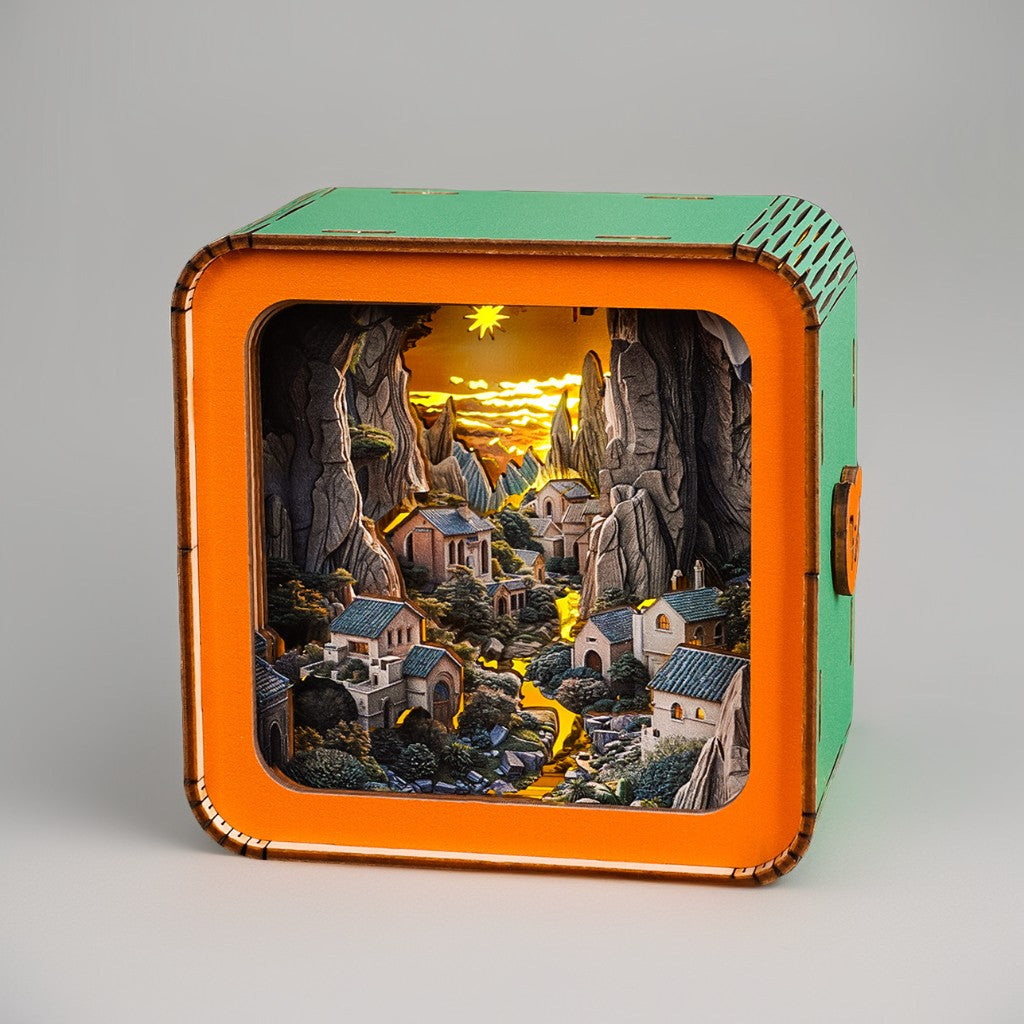 Valley Village Kit 3D wooden puzzle night light showcasing a serene illuminated landscape with houses and mountains.