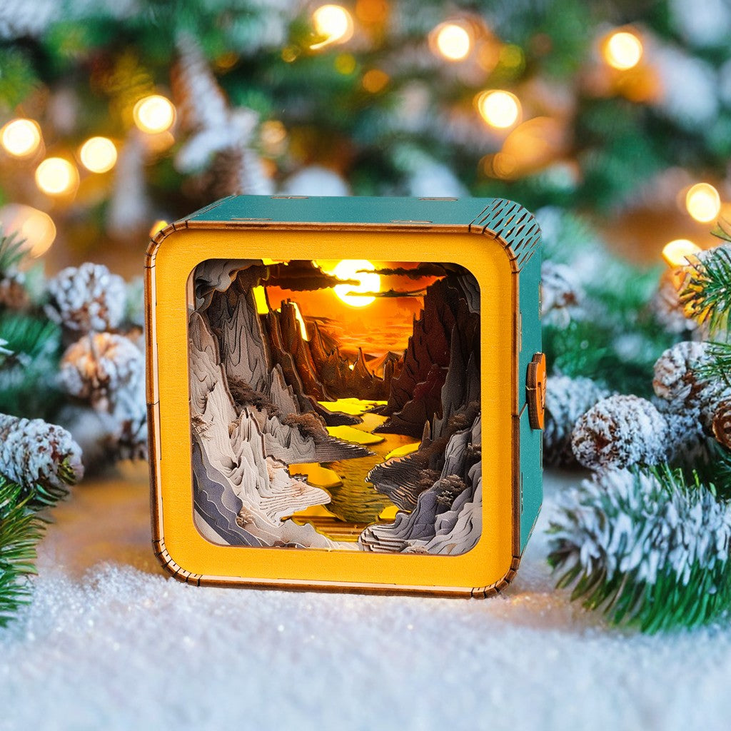 3D wooden puzzle night light featuring a picturesque sunset over a river, surrounded by snowy pine branches.