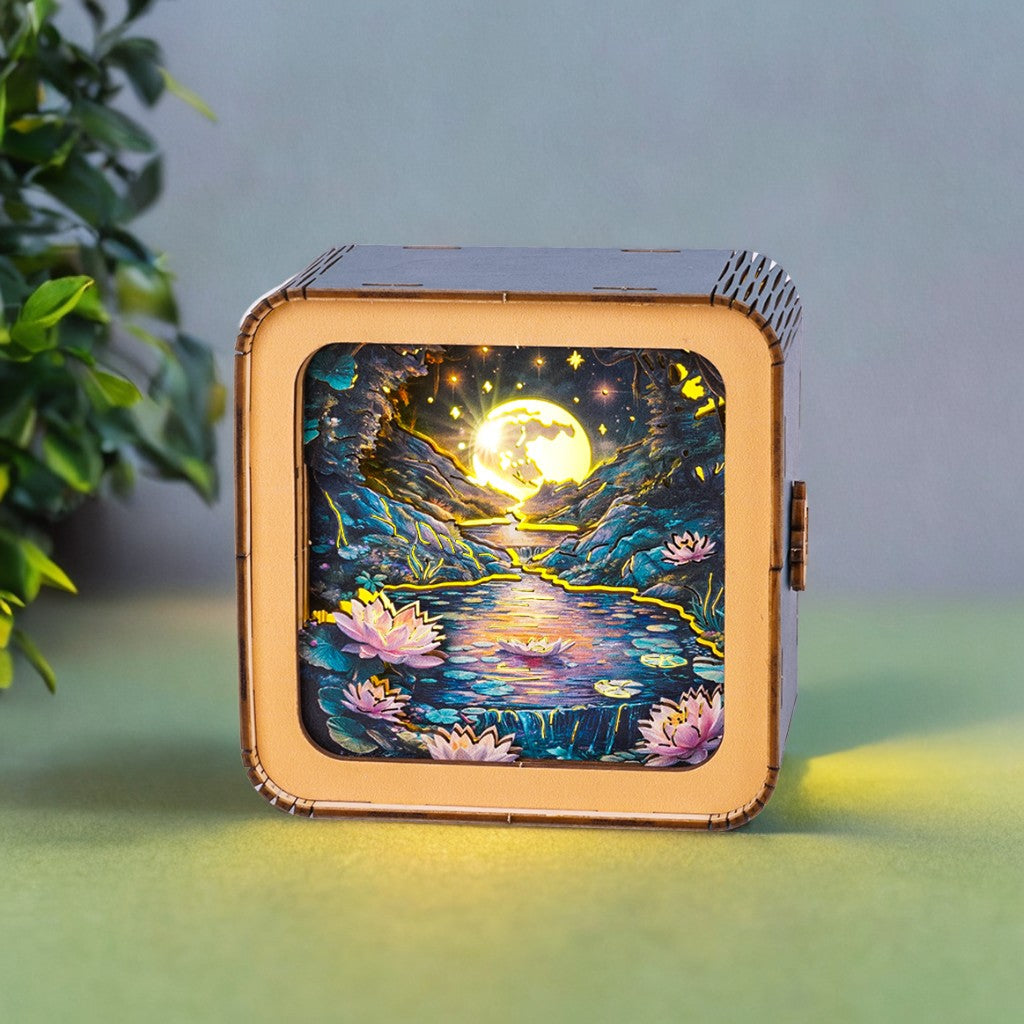 3D wooden puzzle night light featuring a serene moonlit pond with lotus flowers, creating a calming atmosphere.