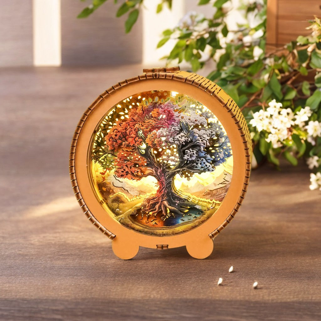 3D wooden puzzle night light featuring a vibrant Tree of Life design with seasonal colors, displayed elegantly.