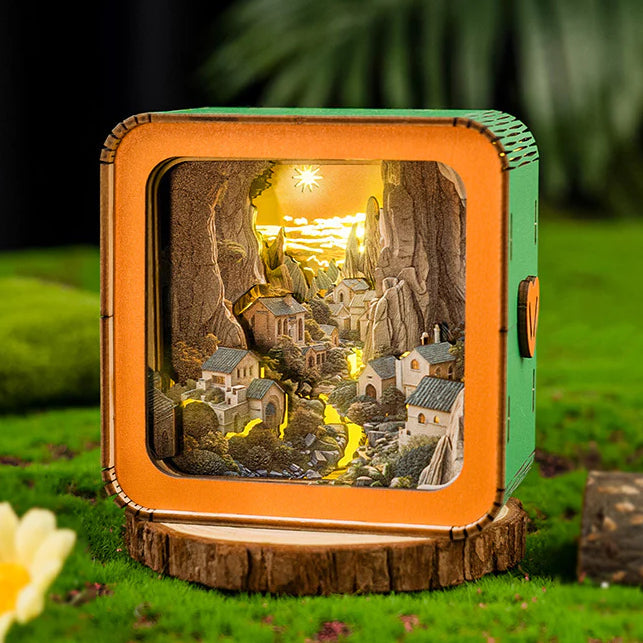 Valley Village Kit 3D wooden puzzle night light with intricate landscape design and warm glowing interior.