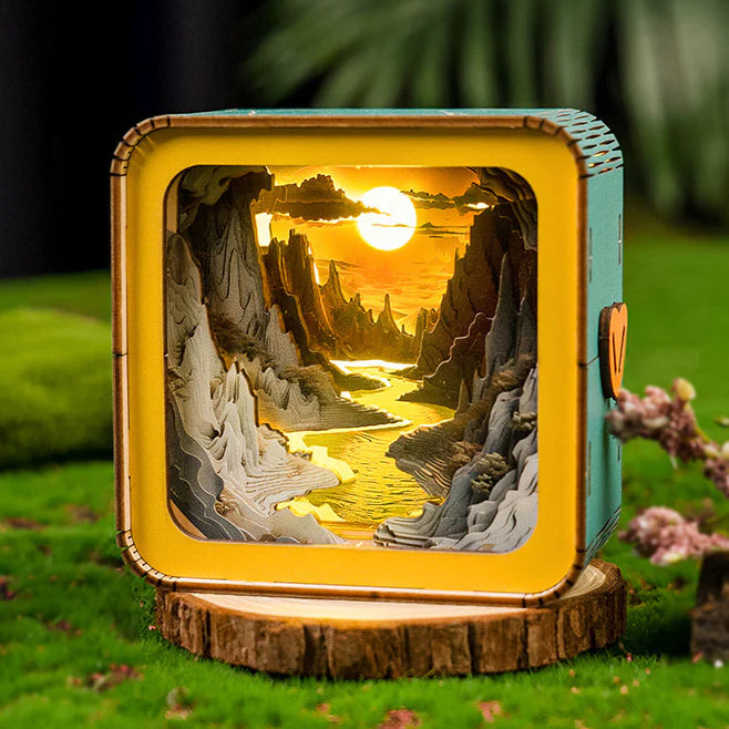 3D wooden puzzle night light depicting a river sunset scene with mountains, creating a warm glow.