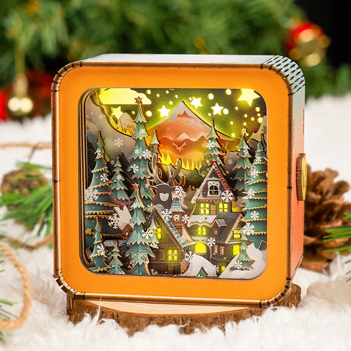 Warm Christmas Eve kit featuring a 3D wooden puzzle night light with illuminated trees and cozy cabin scene.