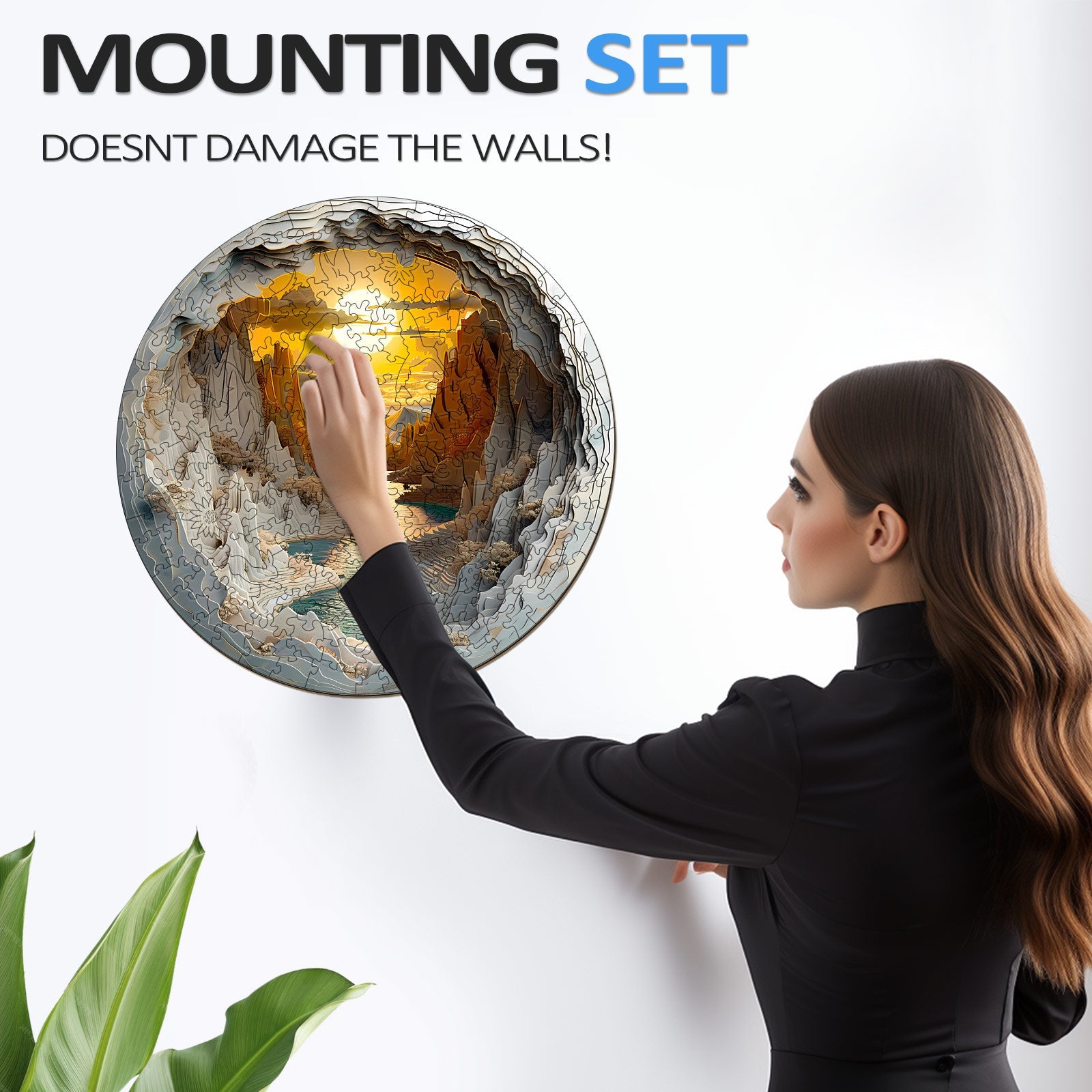 Woman installing a 3D vision inside the cave-1 wooden jigsaw puzzle using a wall mount that doesn't damage walls.